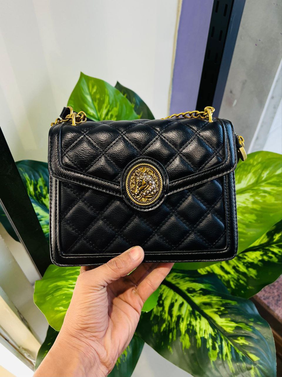 Black quilted Kriste Bell shoulder bag