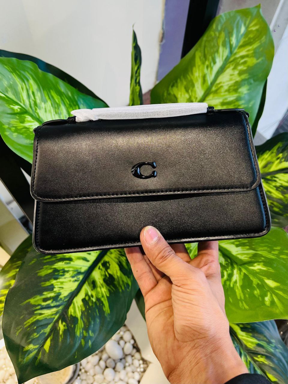Black Coach Juno Bag crafted in soft glovetanned leather