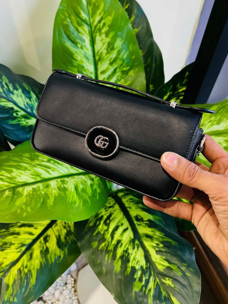 Gucci Small Petite GG Shoulder Bag crafted in smooth black leather