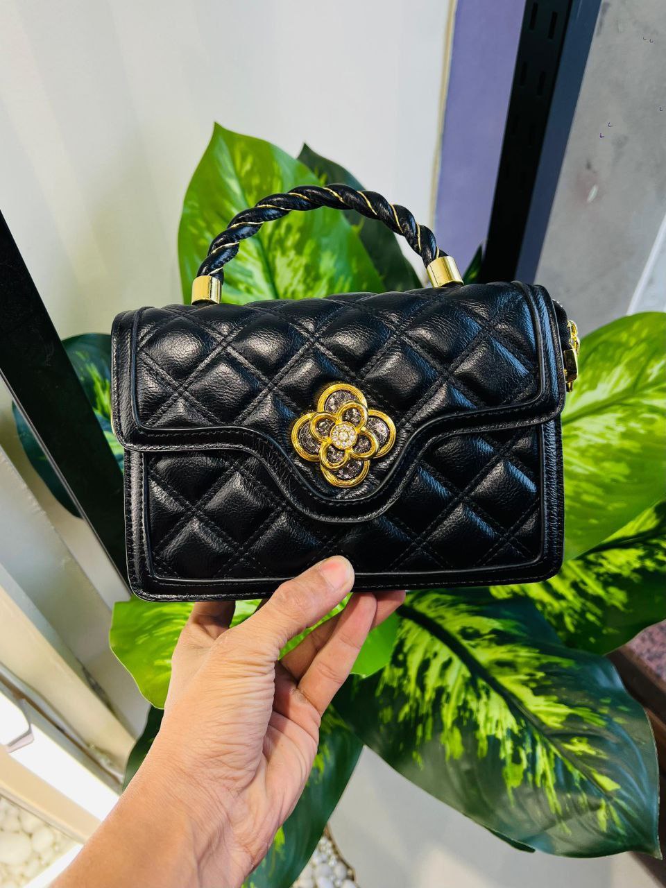 Black quilted handbag from Quỳnh Shop
