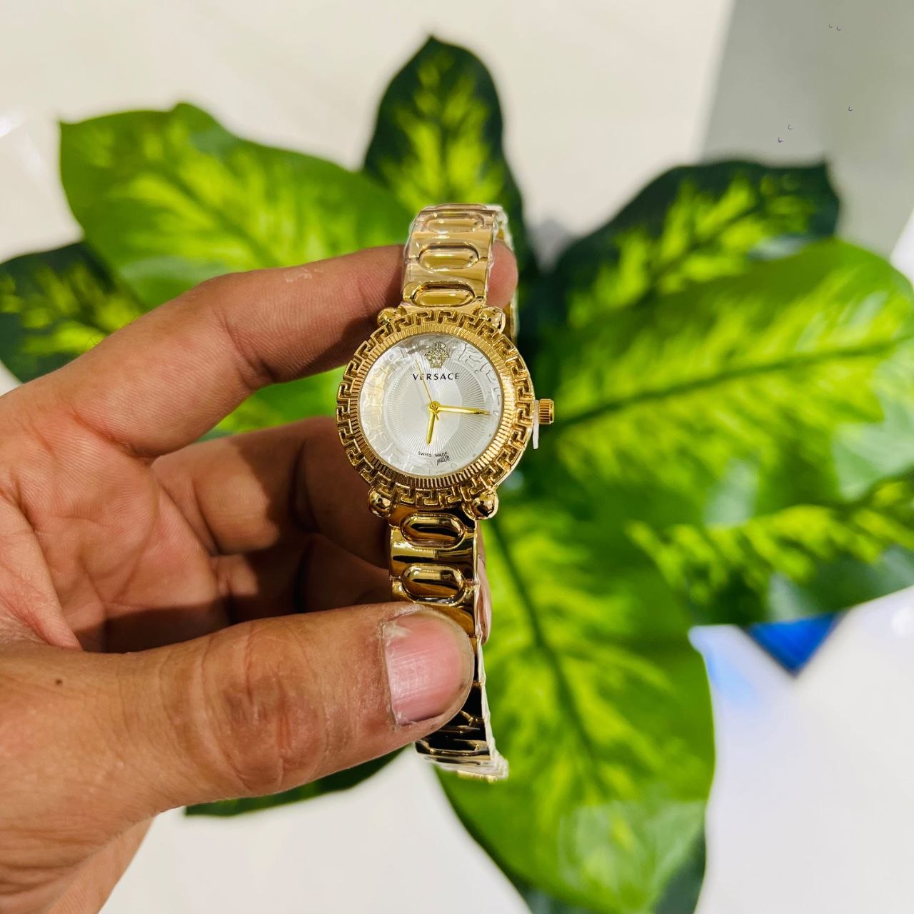 Versace Greca Twist (Model VE6I00423), featuring a distinct gold-tone finish