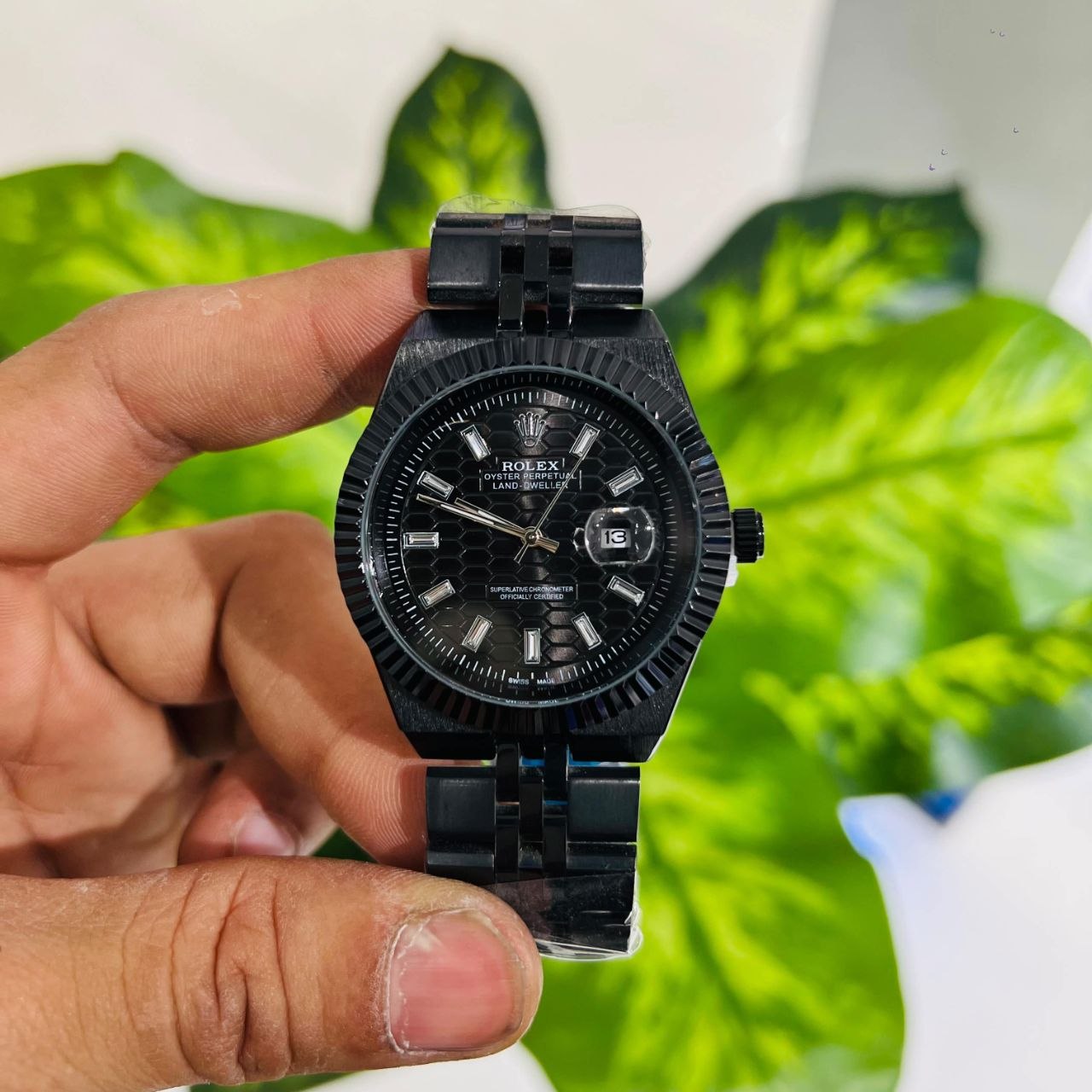 All-black custom or replica-style timepiece featuring a textured honeycomb dial