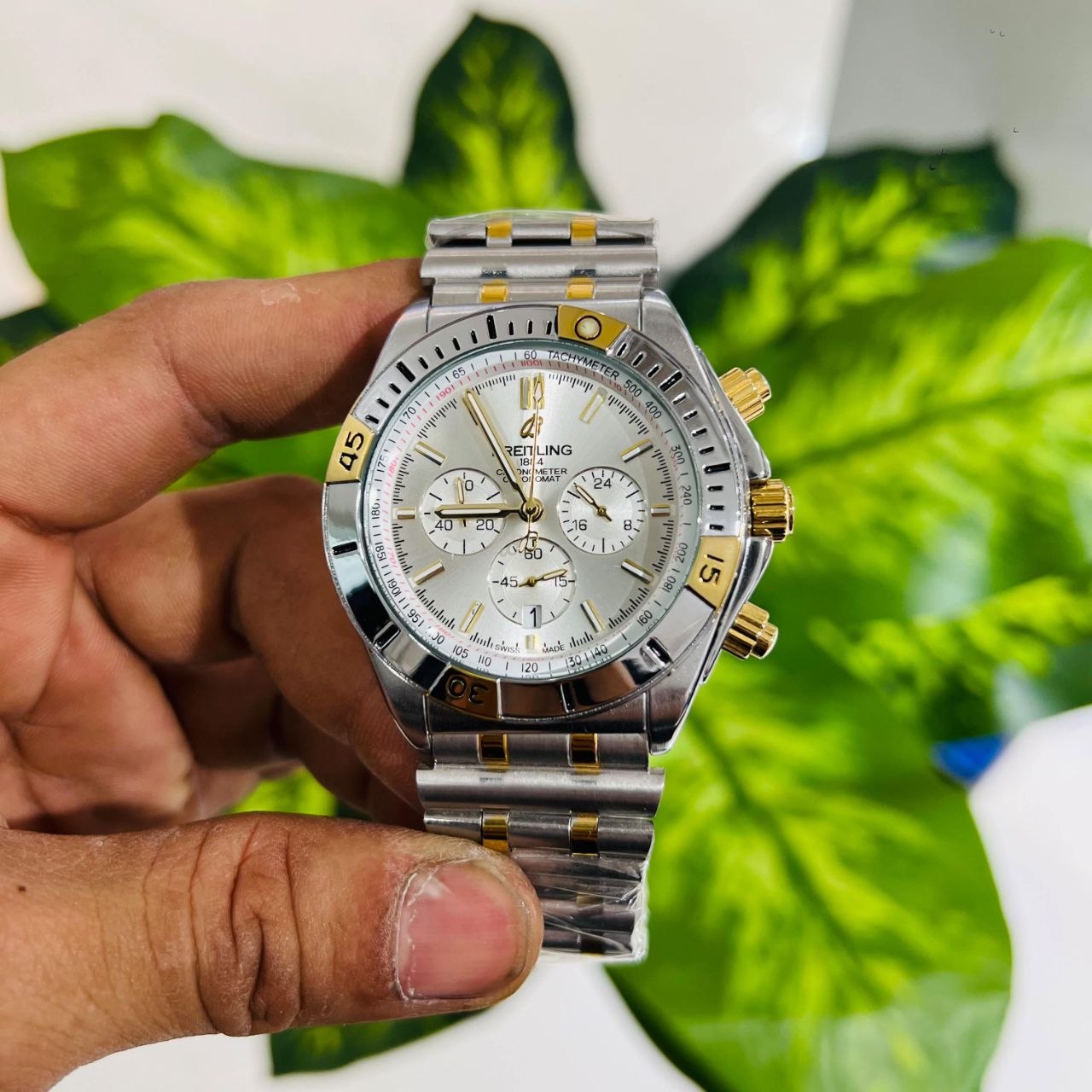 Breitling Chronomat B01 42 two-tone watch featuring a silver dial and 18k red gold accents