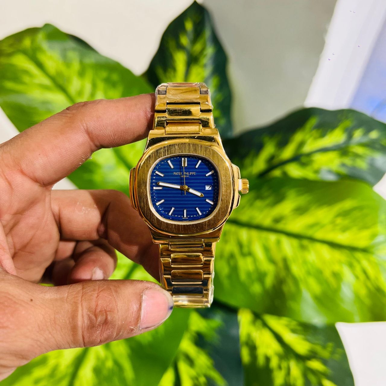 Patek Philippe Nautilus in gold with a blue ribbed dial