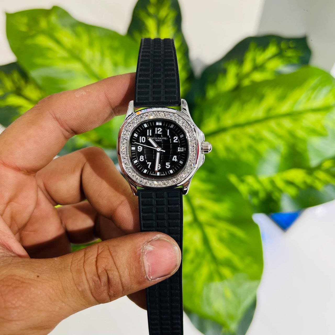 Patek Philippe Aquanaut Luce features a diamond-set bezel and a black embossed dial